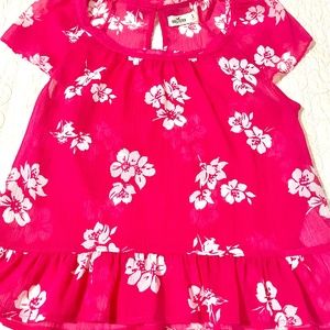 Hollister Small sheer pink top (not red), embellished with a bow in The back.EUC